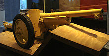 220px-Canon_de_75_modele_1897_used_at_Bir_Hakeim_modified_as_an_antitank_gun_on_pneumatic_wheels.jpg